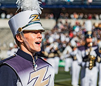 A member of the marching band who is taking classes at The University of Akron