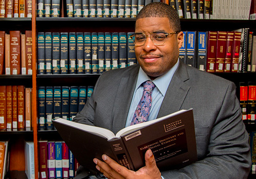 Law student holding a book