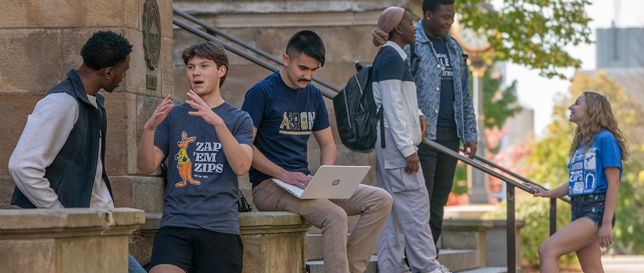 Student smiling while hanging out around campus