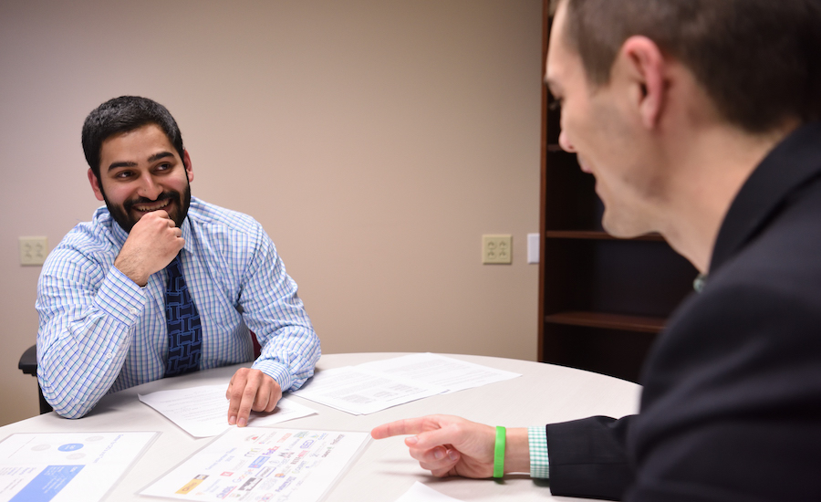 Fisher Institute student in a meeting with a corporate partner