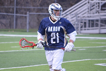 Student playing lacrosse