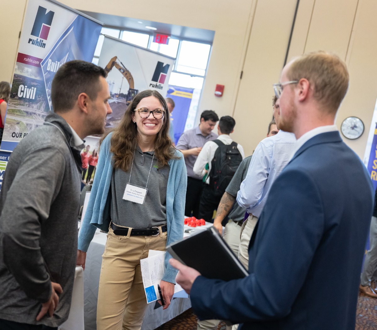 Students talking to employer at career fair