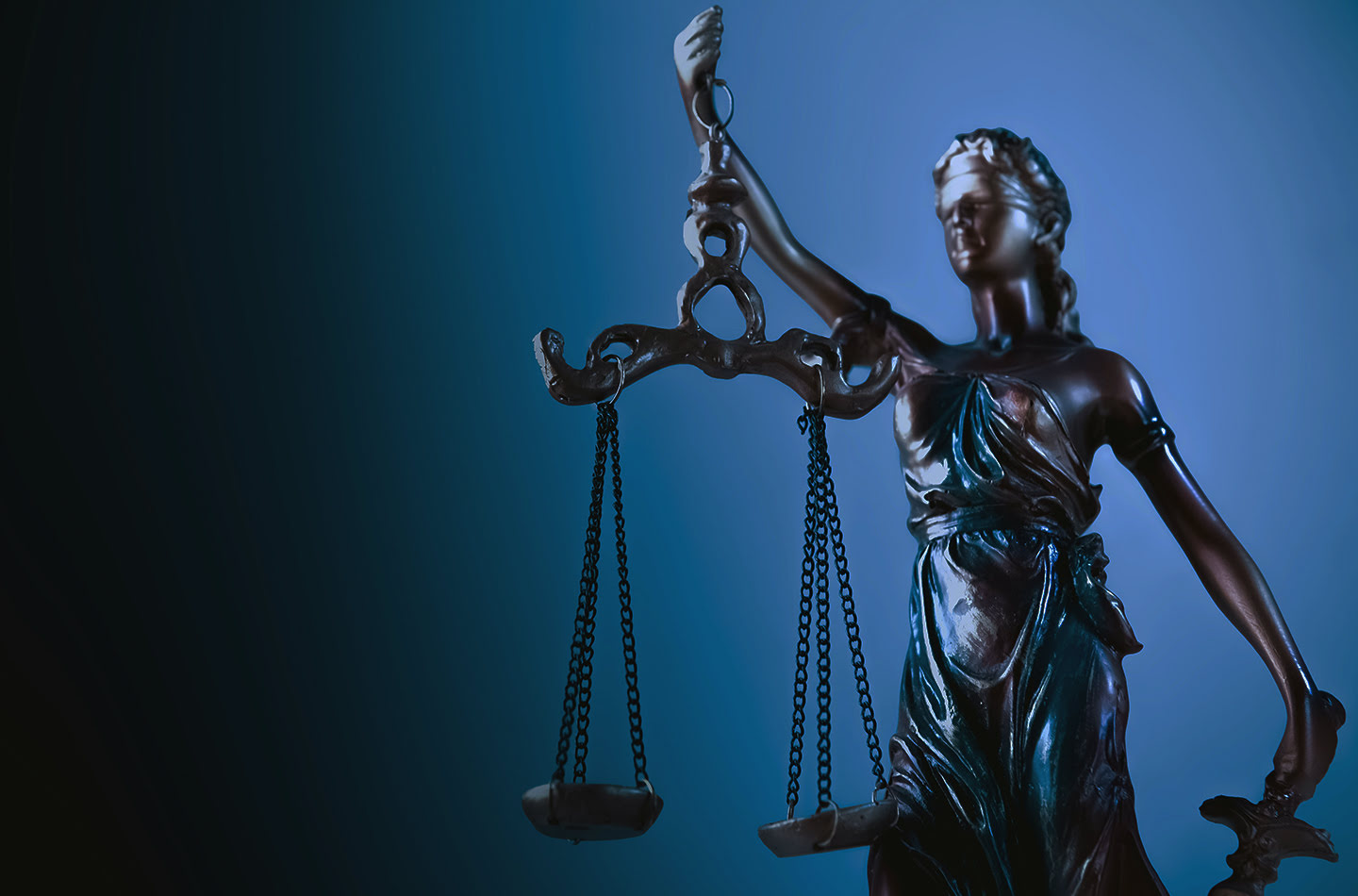 Statue of justice holding scales