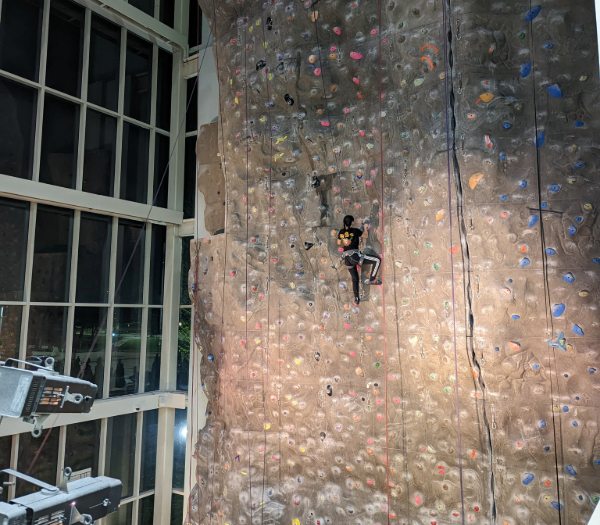 participant climbing a indoor climbing wall