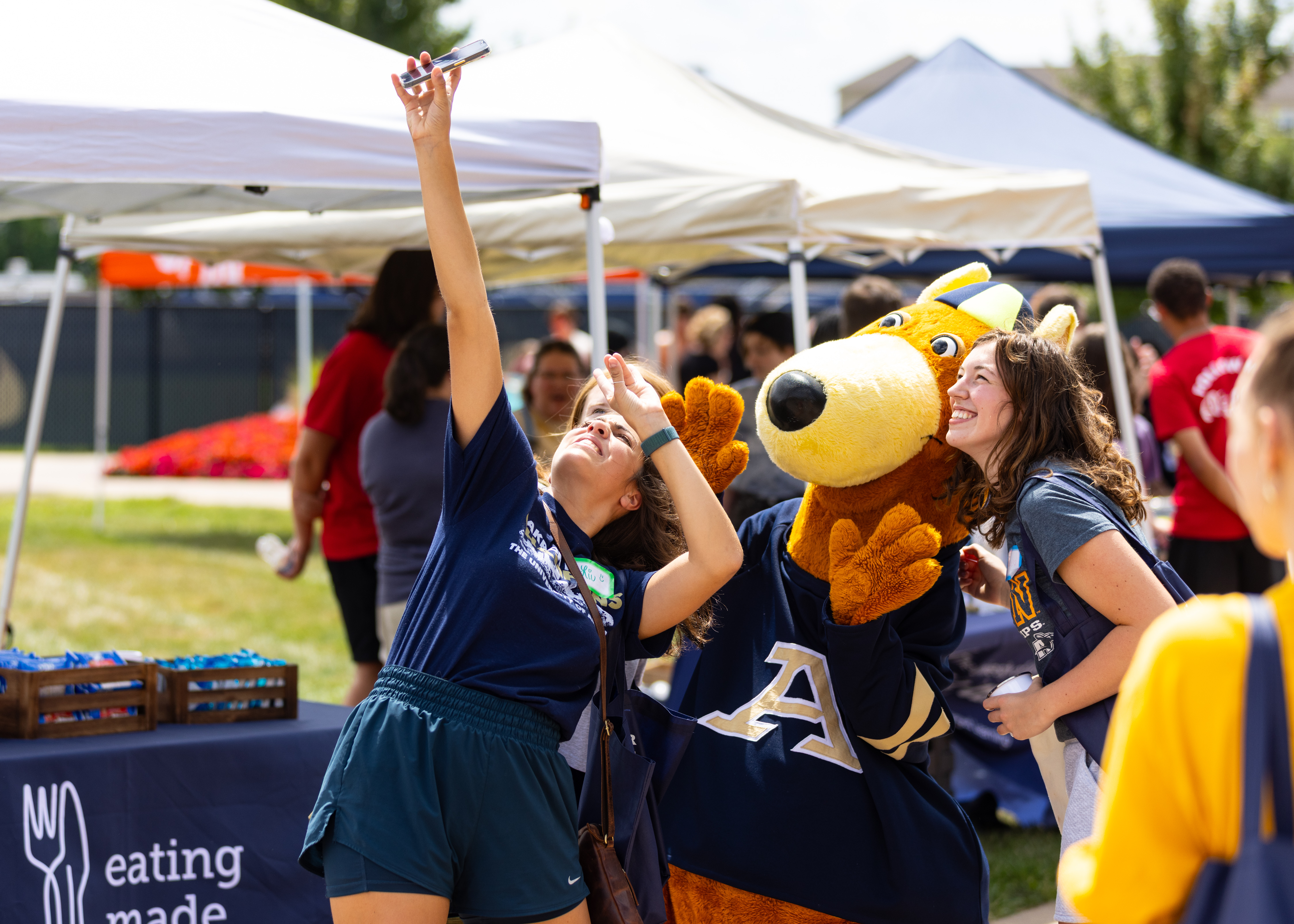 Two UA students taking a selfie with Zippy