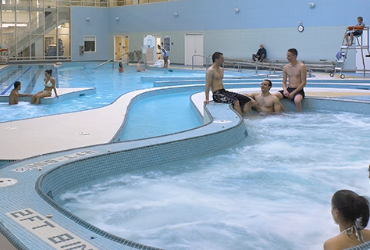 Students enjoying a hot tub and leisure pool activities
