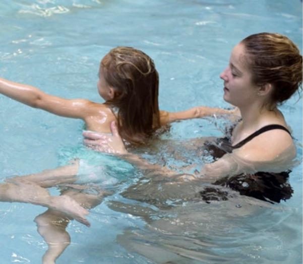 instructor providing swim instruction