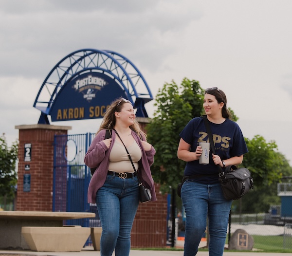 Students enjoying a walk on Buchtel Comons