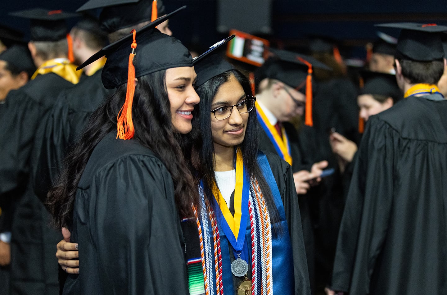 Two international students at graduation