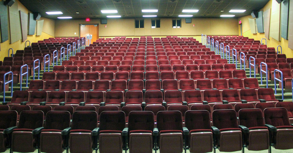 Gardner Theatre with tiered seating and stage lighting at the University of Akron