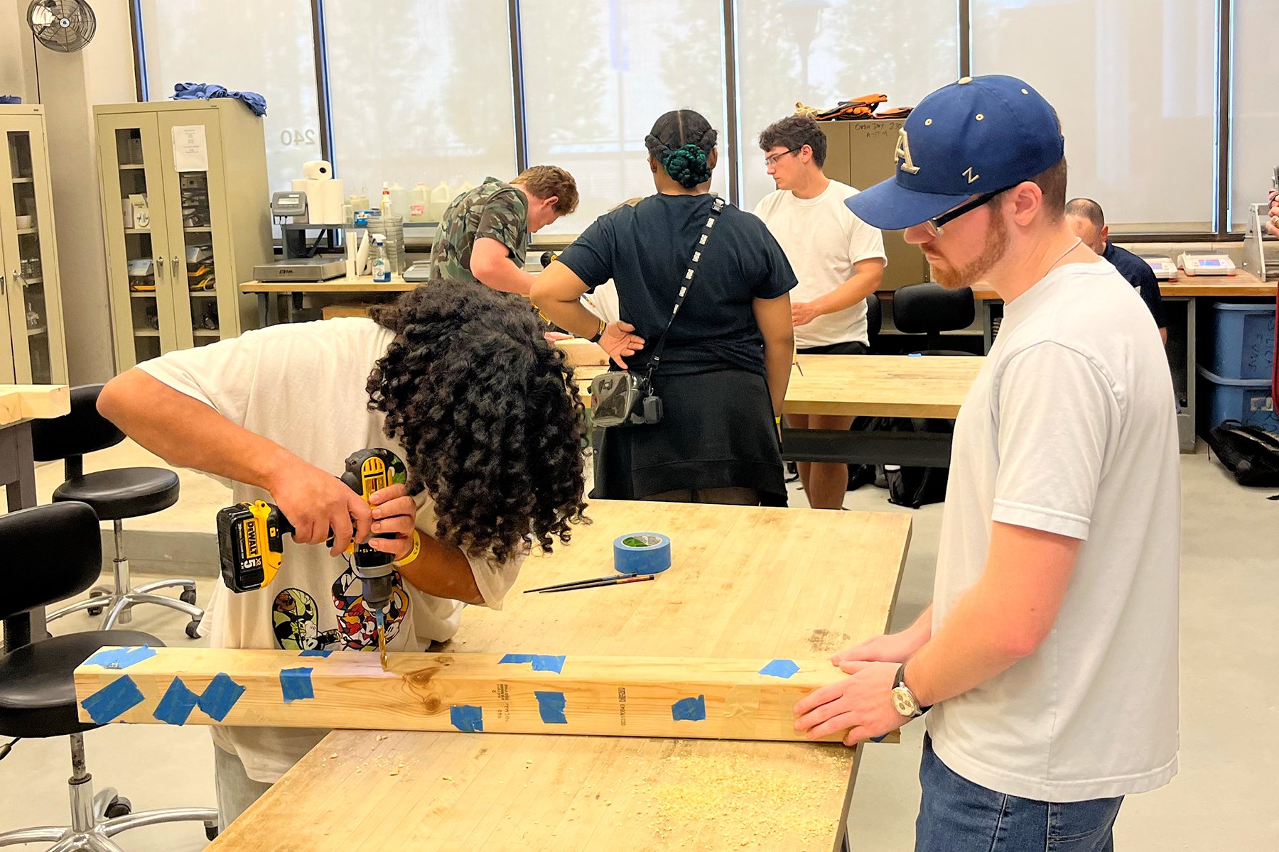 A student competes in the 'Drilling for Dollars' event.