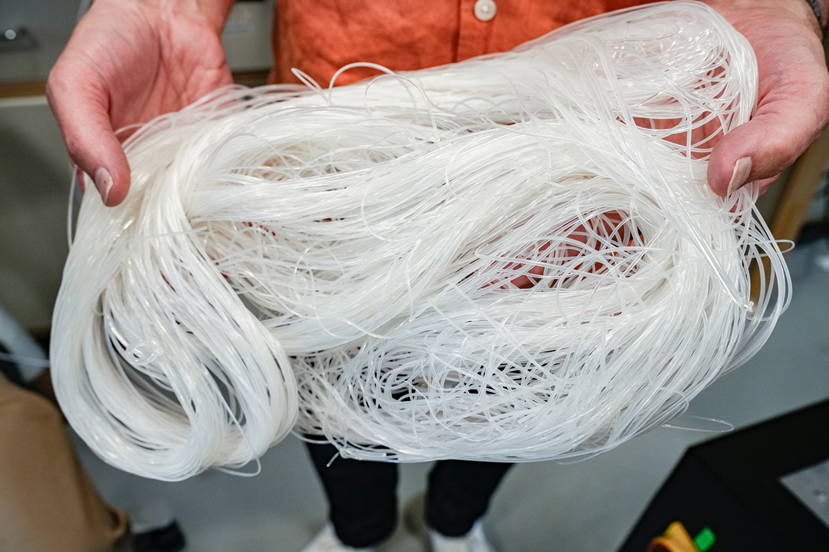 The new solvent-free, spaghetti-like version of BEVA 371 Akron before it is trimmed into pellets and packaged for distribution. Photo by Nita L. Roberts.