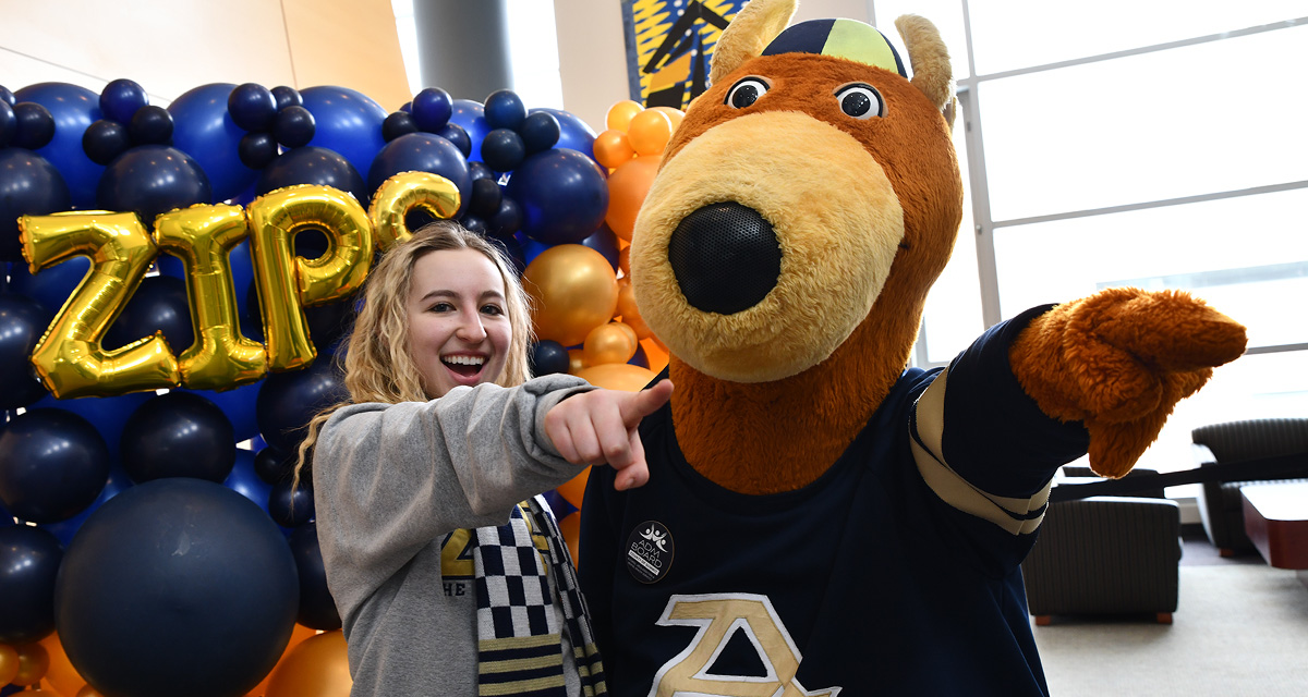 Zippy and a UA student pointing