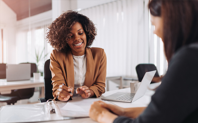 A program graduate working with a client.