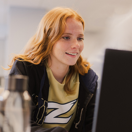 Prospective UAkron Online student applying on computer